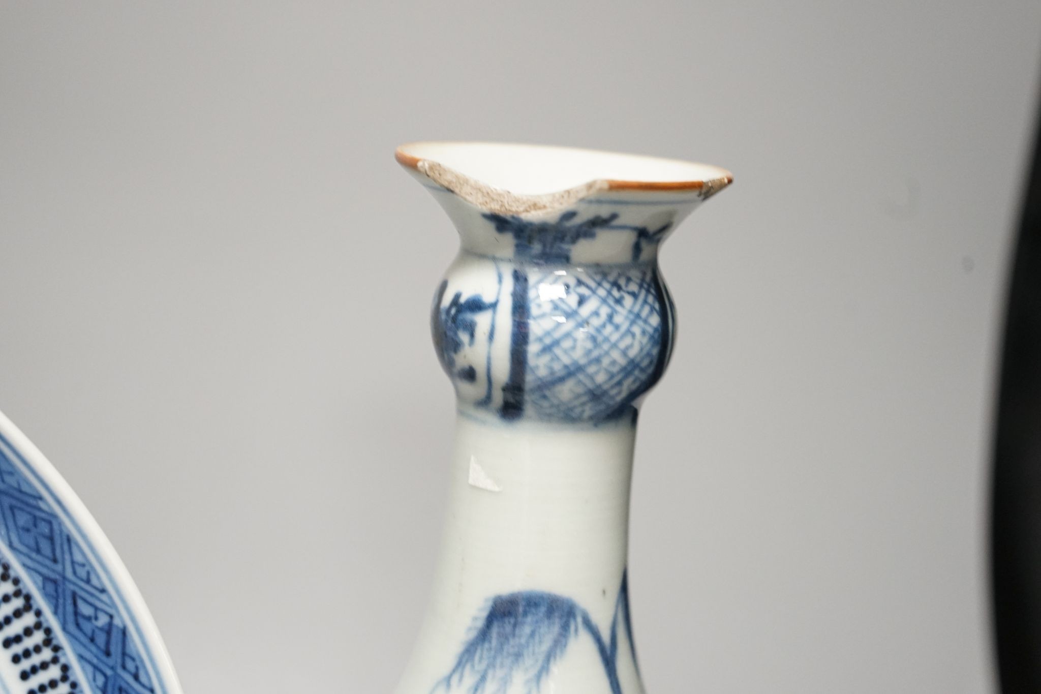 An 18th century Chinese blue and white bottle vase and two 19th century blue and white plates, diameter of largest plate - 25cm